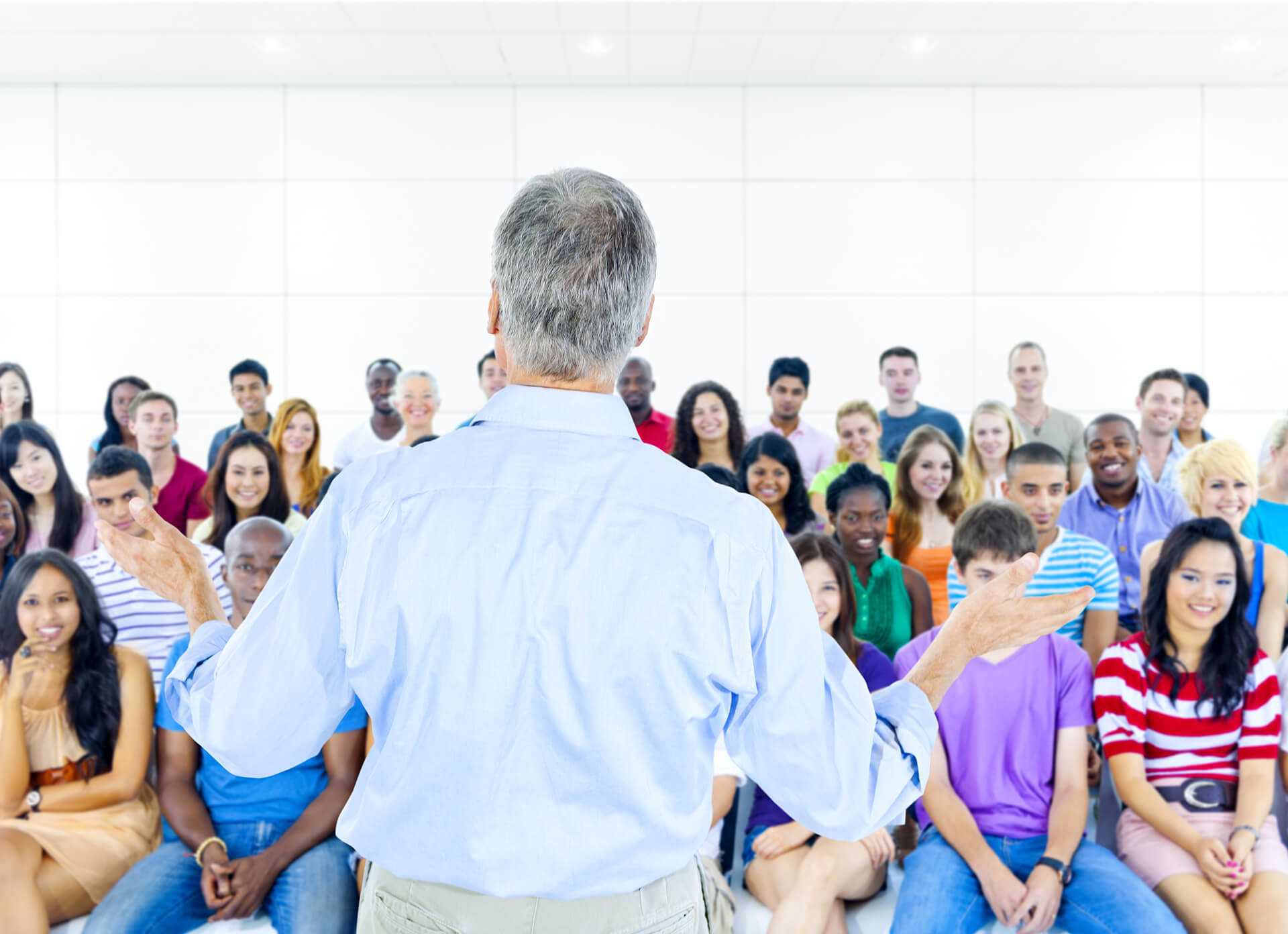 man instructing a class of young students